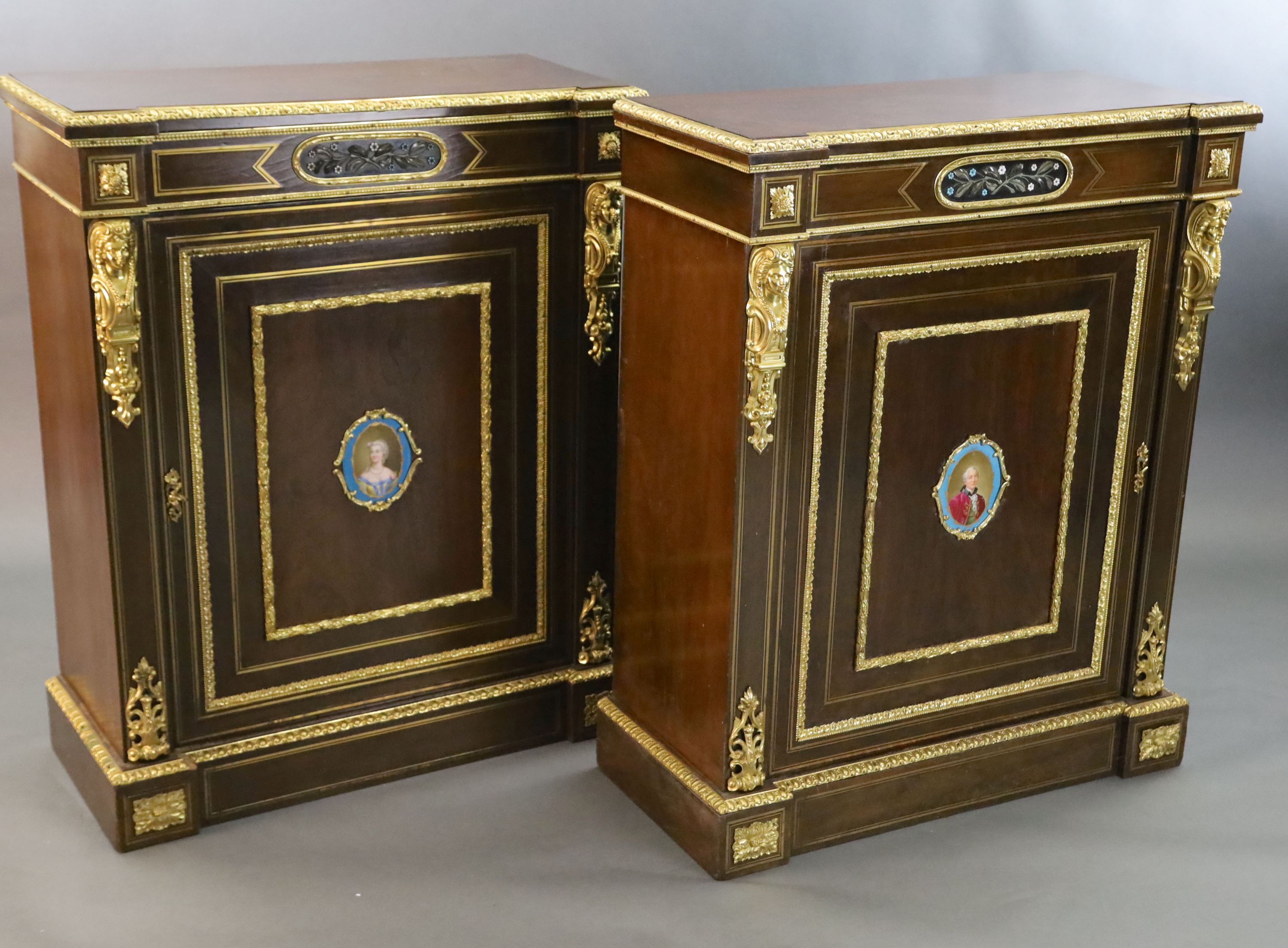 A pair of 19th century French ormolu mounted walnut pier cabinets, W.2ft 11in. D.1ft 4in. H.3ft 7in.